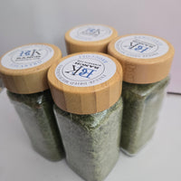 Four BCK Ranch freeze-dried microgreens jars with labeled bamboo lids