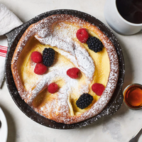 Dutch baby pancake with berries in a Field Company cast iron skillet