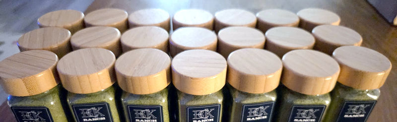 Rows of BCK Ranch freeze-dried microgreen spice jars with bamboo lids